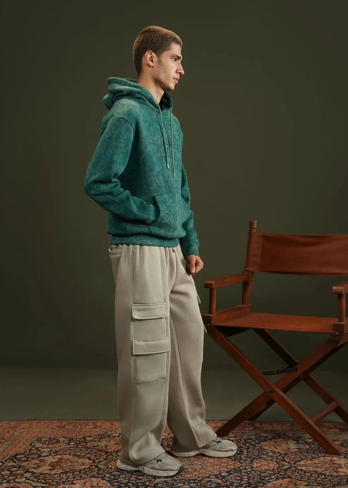 Teal terry pullover hoodie with hood and kangaroo pocket, side view