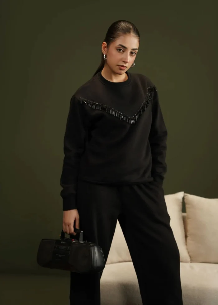 Black crewneck fleece sweatshirt with V-shaped fringe trim