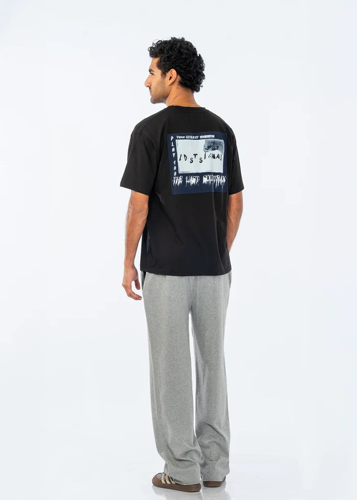 Black crew-neck T-shirt with large back typography graphic, rear view