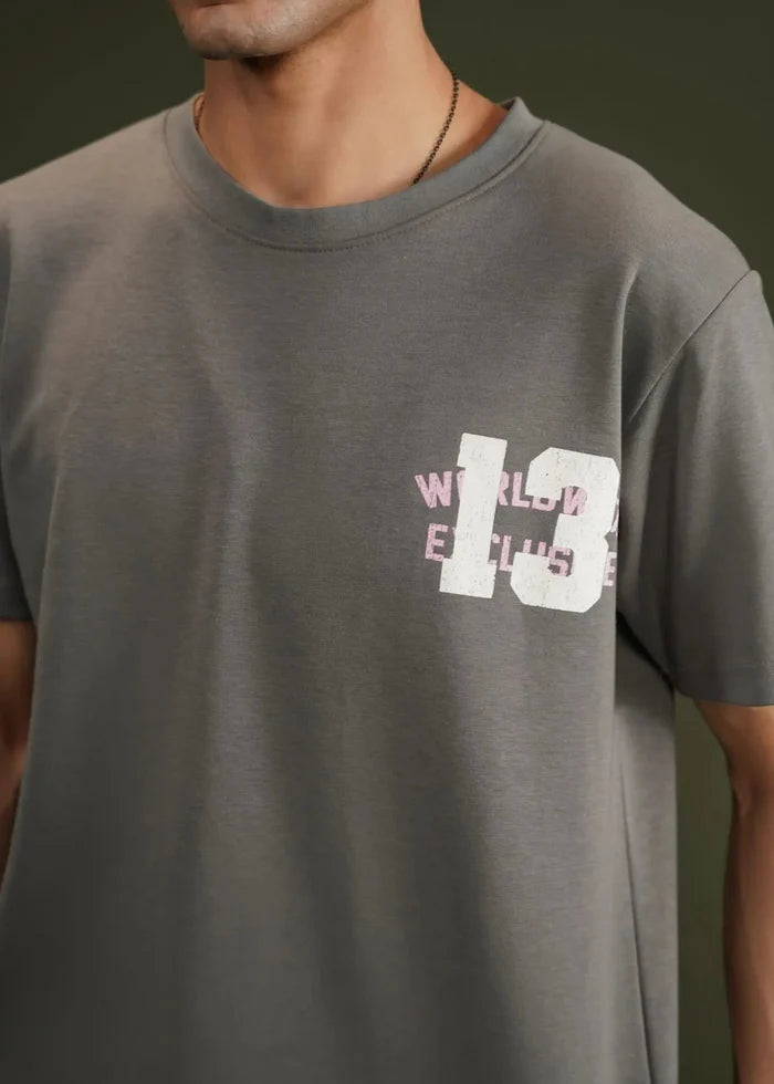 Charcoal grey terry crew-neck t-shirt with chest graphic print, close-up.