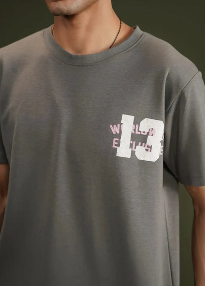 Charcoal grey terry crew-neck t-shirt with chest graphic print, close-up.