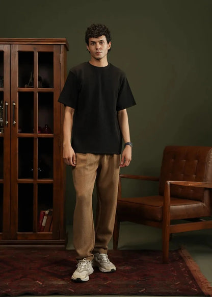 Men's black waffle-knit T-shirt, front view, crew neck with short sleeves