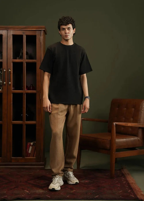 Men's black waffle-knit T-shirt, front view, crew neck with short sleeves