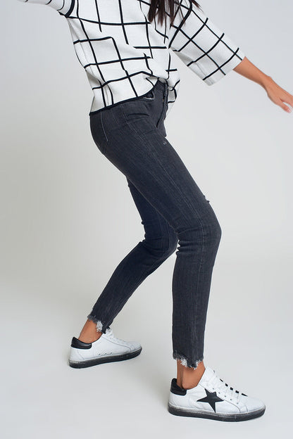 mid rise jeans in black with raw hem - Denim