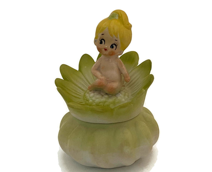 Midcentury Ceramic Flower Dresser Jar with Baby Sitting Atop at Duckwells