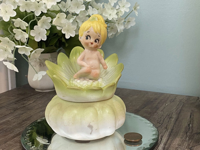 Midcentury Ceramic Flower Dresser Jar with Baby Sitting Atop at Duckwells