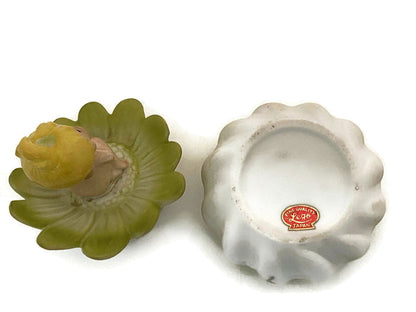 Midcentury Ceramic Flower Dresser Jar with Baby Sitting Atop at Duckwells
