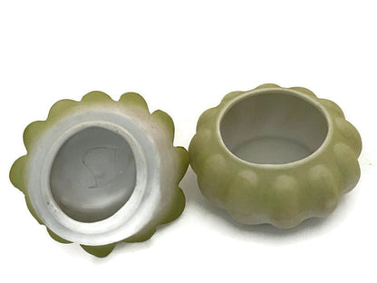 Midcentury Ceramic Flower Dresser Jar with Baby Sitting Atop at Duckwells