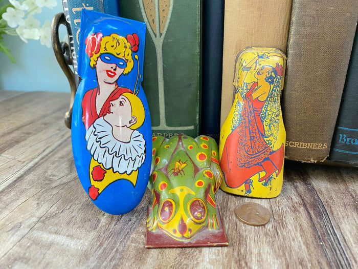 Midcentury Tin Litho Clickers at Duckwells