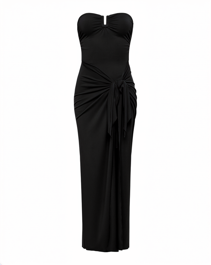 Off-model view of the LSPACE Noah Dress in black, displayed on a white background to show the full silhouette with strapless keyhole neckline, ruched side tie, and maxi skirt with slit.