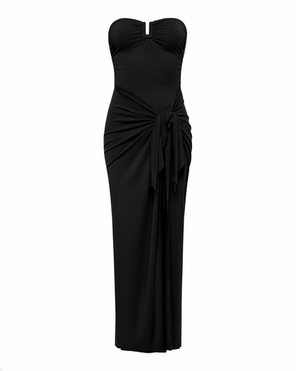 Off-model view of the LSPACE Noah Dress in black, displayed on a white background to show the full silhouette with strapless keyhole neckline, ruched side tie, and maxi skirt with slit.