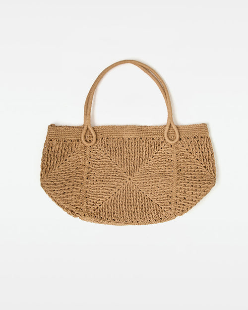 Off-model front view of the natural Paloma Beach Tote, a woven crochet bag with dual loop handles.