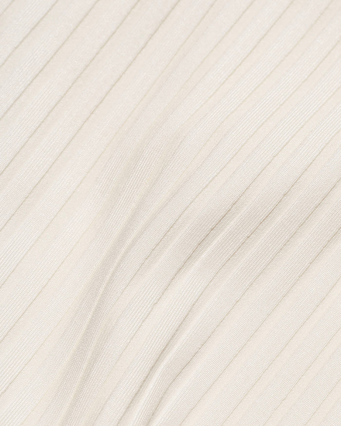 Close-up detail of the cream ribbed eco-friendly fabric texture of the LSPACE Peyton Bikini Top, off-model.