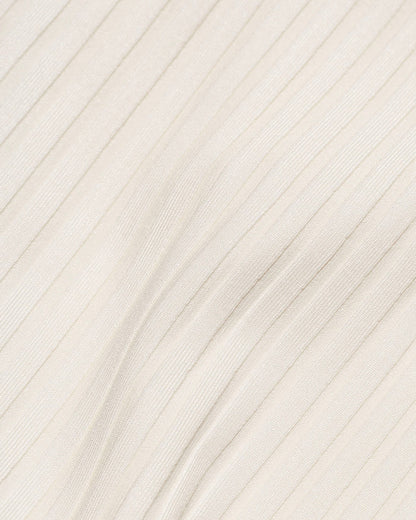 Close-up detail of the cream ribbed eco-friendly fabric texture of the LSPACE Peyton Bikini Top, off-model.