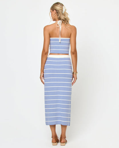 Back view of a model wearing the LSPACE Positano Top and Ravello Skirt in outer banks stripe, showing the fitted silhouette and blue and cream horizontal stripe pattern.