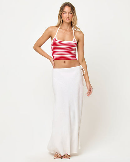 Front view of a model wearing the LSPACE Positano Top in superbloom stripe, a cropped halter top with a square neckline and red and cream horizontal stripes.