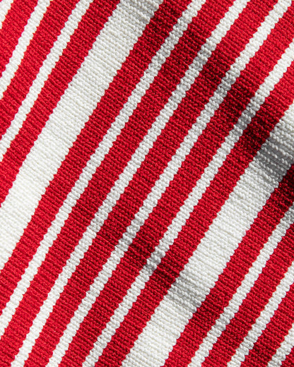 Close-up of the LSPACE Positano Top and Ravello Skirt in superbloom stripe, highlighting the ribbed red and cream horizontal stripe fabric texture.