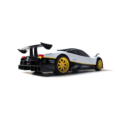 Rastar 1:14 Pagani Zonda R RC car in white and black livery with yellow wheels, photographed from a rear three-quarter angle showing the multi-element rear wing, round tail lights, "Zonda R" and "Pirelli BSPO" rear badging, and the distinctive quad-exhaust pipe cluster.
