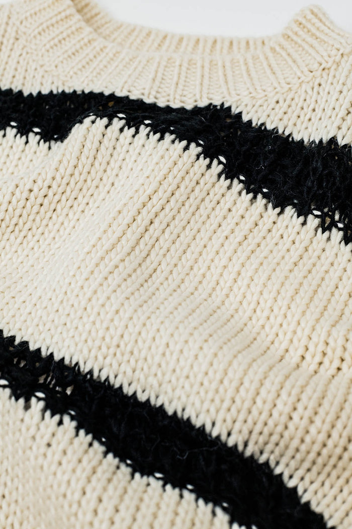 Relaxed beige jumper with black stripes