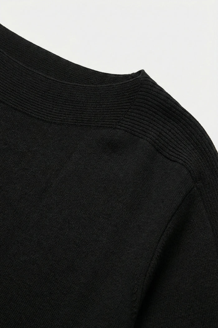 Relaxed black boatneck sweater with dropped sleeves