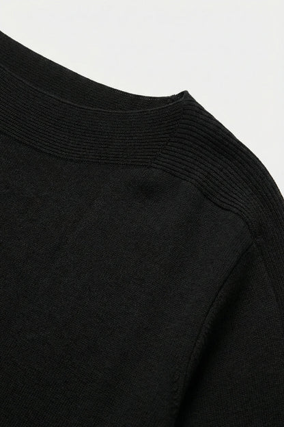 Relaxed black boatneck sweater with dropped sleeves