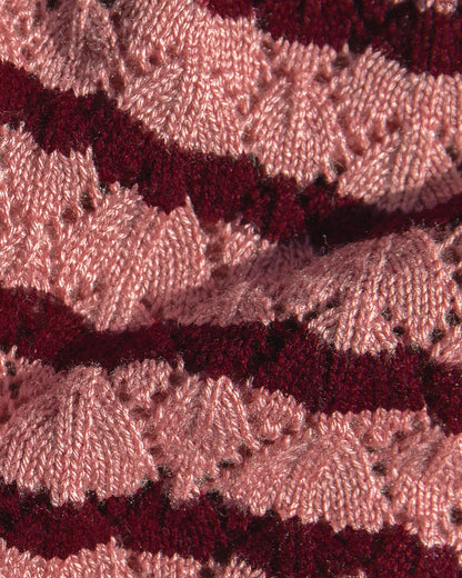 Close-up front view of a model wearing the LSPACE Rosalie Maxi styled with the matching Rosalie Cardigan in strawberry stripe.