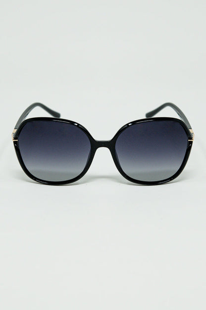 Round sunglasses in black with gold metal detail