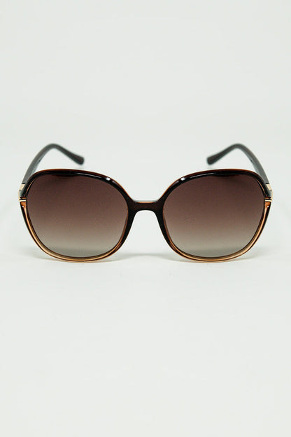 Round sunglasses in caramel color with gold metal detail