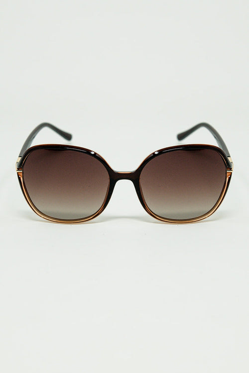 Round sunglasses in caramel color with gold metal detail
