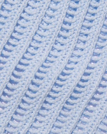 Close-up of the LSPACE Sander Top in French blue, showing the open-knit crochet stitch texture and construction detail.