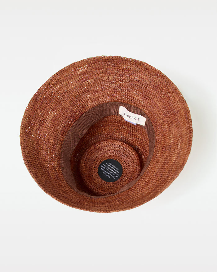 Interior view of the brown Seville Hat showing the LSPACE label inside.