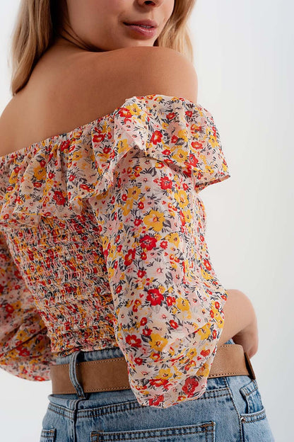 Shirred off the shoulder top with ruffle in coral floral print