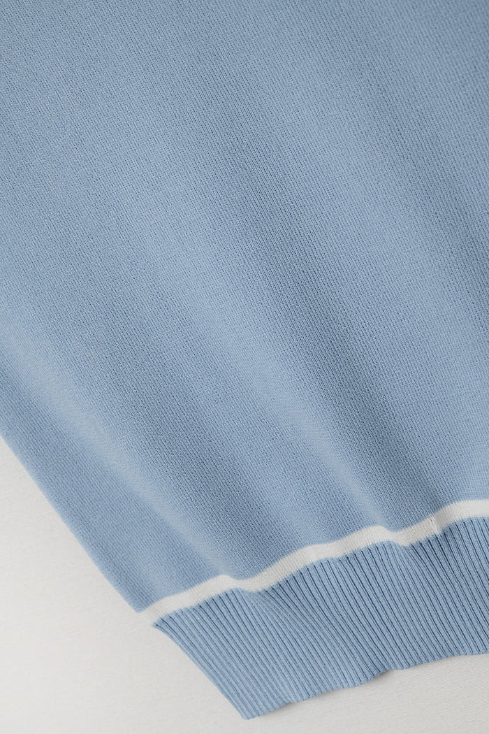 Sleeveless Sweater In Blue Featuring White Lines detail
