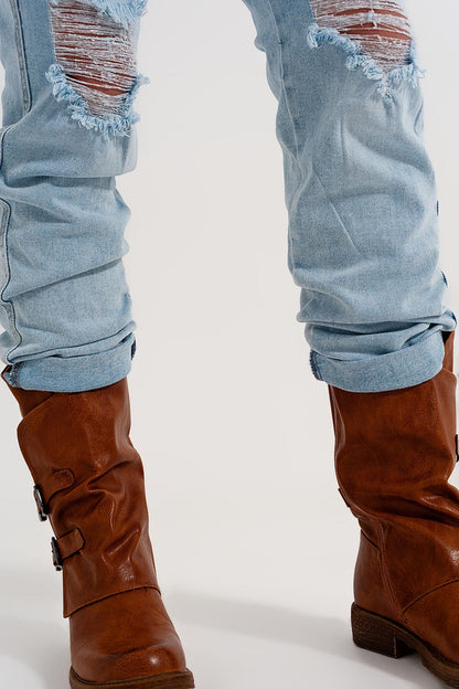 Straight leg distressed jeans with button detail in light blue - Denim