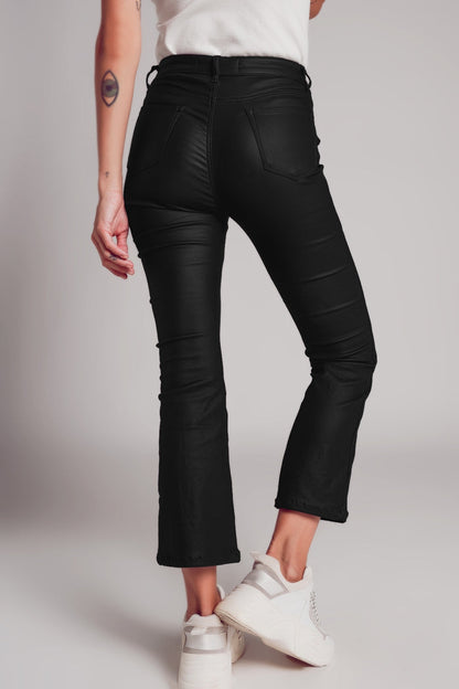 Stretch faux leather flare pants in black - trousers
