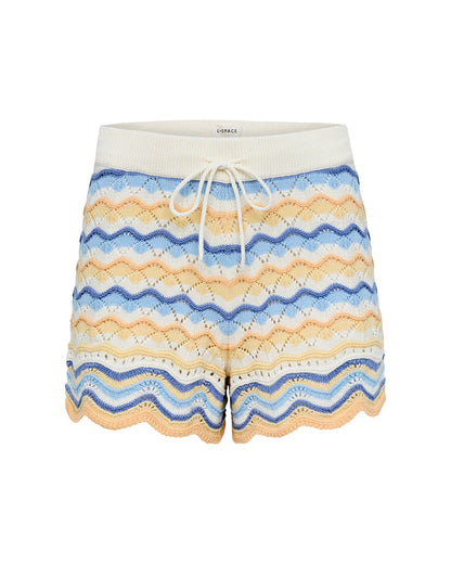 Off-model view of the LSPACE Sunchaser Short in Daydreamer, a crochet mini short in a blue, peach, and white wave pattern with cream waistband and drawstring.