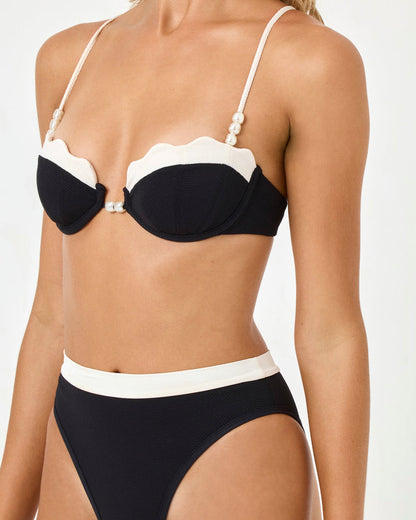 LSPACE Sunrise Shell bikini top in black-cream, close-up detail view on model.