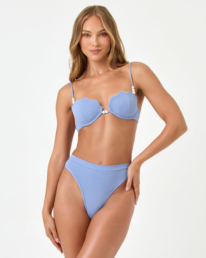 Front view of a model wearing the LSPACE chambray Sunrise Shell Bikini Top styled with the Frenchi Bikini Bottom.