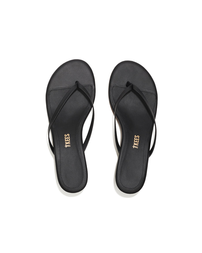 Top-down view of both black sable leather TKEES Julia Kitten Heel thong sandals.