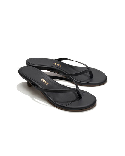 Angled side view of a single black sable leather TKEES Julia Kitten Heel sandal showing the kitten heel.