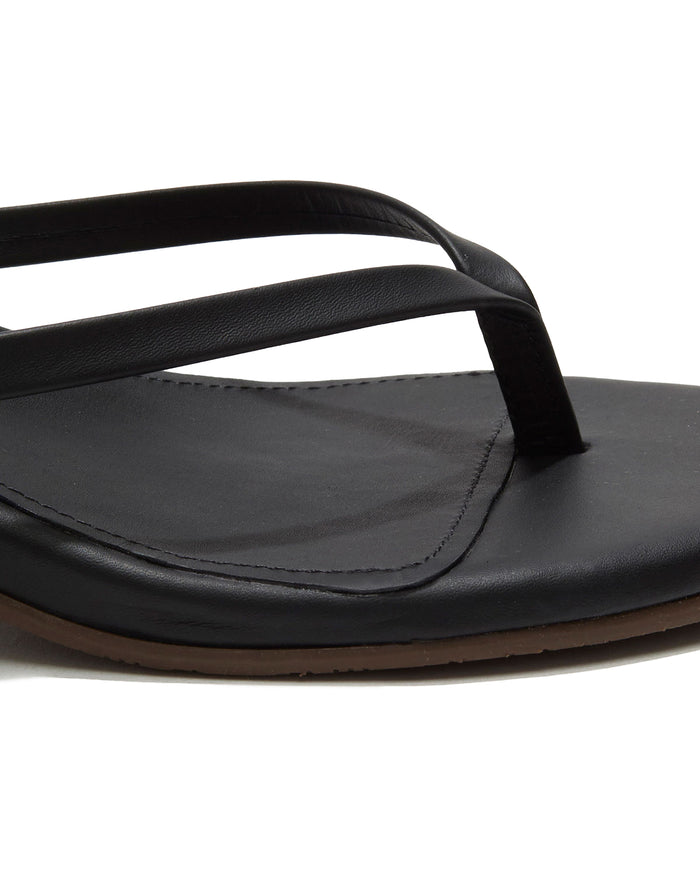 Close-up of the black sable leather thong strap and square-toe footbed on the TKEES Julia Kitten Heel.