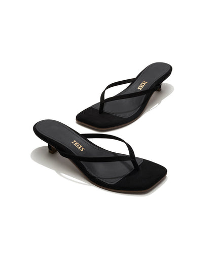 Angled view of both black suede TKEES Square Toe Julia sandals with gold TKEES logo on footbed.