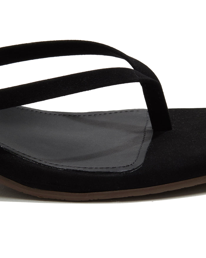 Close-up of the black suede thong strap and square-toe footbed on the TKEES Square Toe Julia Suede.