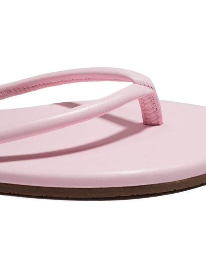 Close-up of the powder pink tubular thong strap and footbed detail on the TKEES Tubular Lily.