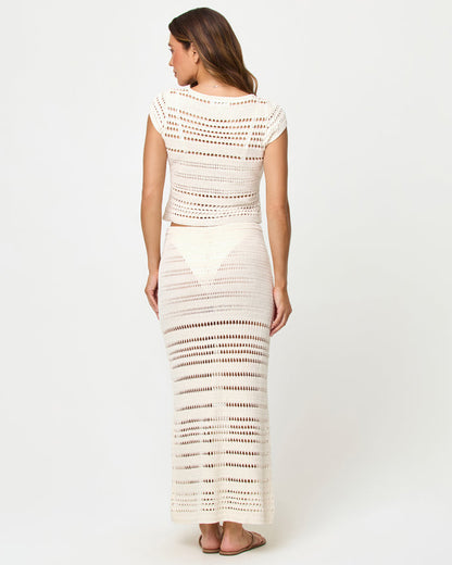 Back view of model wearing the LSPACE Tula Top and Skirt in cream.