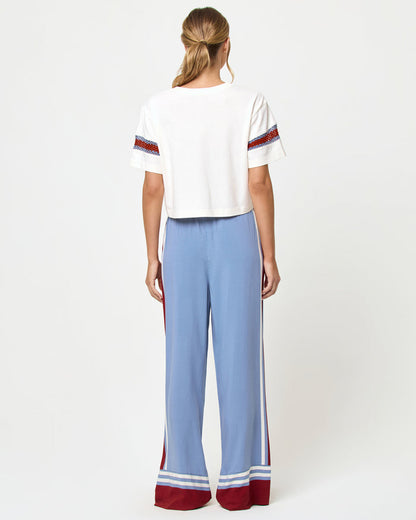 Back view of model wearing the LSPACE Unwind Pant in unwind stripe.