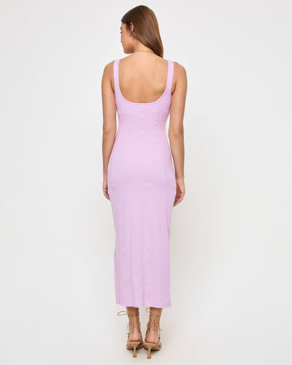 Back view of a model wearing the LSPACE Vivienne Dress in light iris, showing the low scoop-back design.