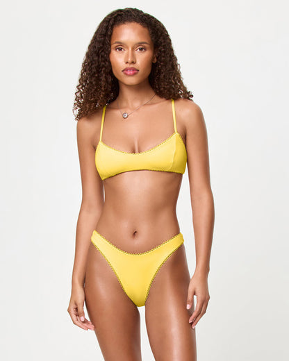 LSPACE Whimsy bikini top in Ditsy, front view on model.