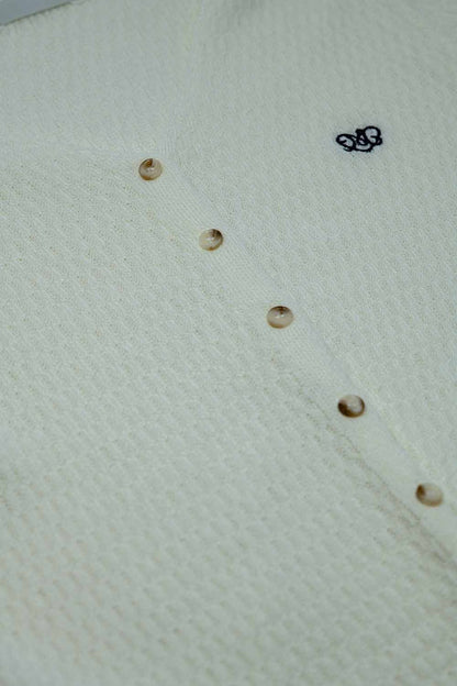 White cardigan with short sleeves and front closure with button