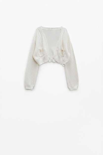 White long sleeve cardigan with button closure and front pockets